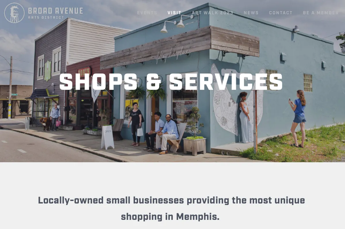 A lively streetscape featuring colorful storefronts, vibrant artistic murals, and people interacting along the sidewalk. The image captures the energetic, creative spirit of a bustling Memphis neighborhood, ideal for exploring local dining, art, and social scenes.